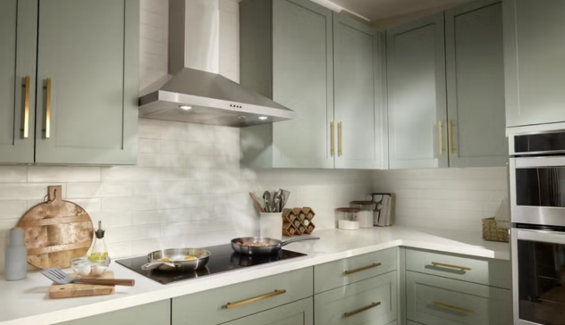 A modern kitchen equipped with a stainless steel chimney hood efficiently extracting steam, promoting clean air and better ventilation.