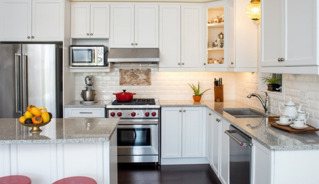 A U-shaped modular kitchen designed with ample storage, appliance zones, and universal cabinet sizing — allowing easy updates in the future.