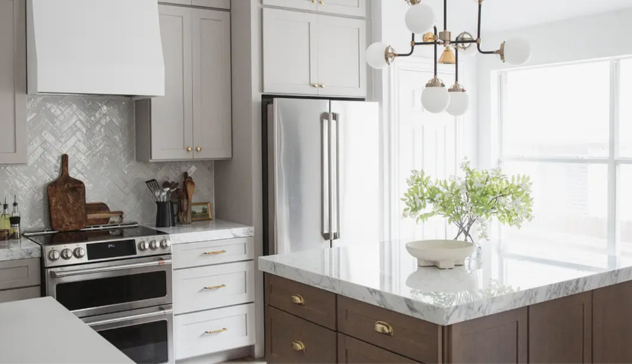 Bright kitchen with white and dark wood cabinets