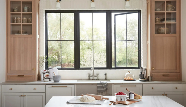 Modern Kitchen with Windows Kitchen with large windows letting in natural light, with light-colored cabinetry and countertops.