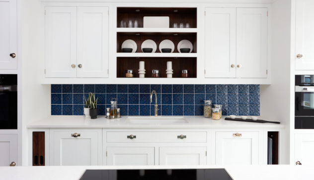 **Reflective Backsplash and Light Cabinets** Close-up of a reflective backsplash and light-colored cabinets to emphasize brightness.