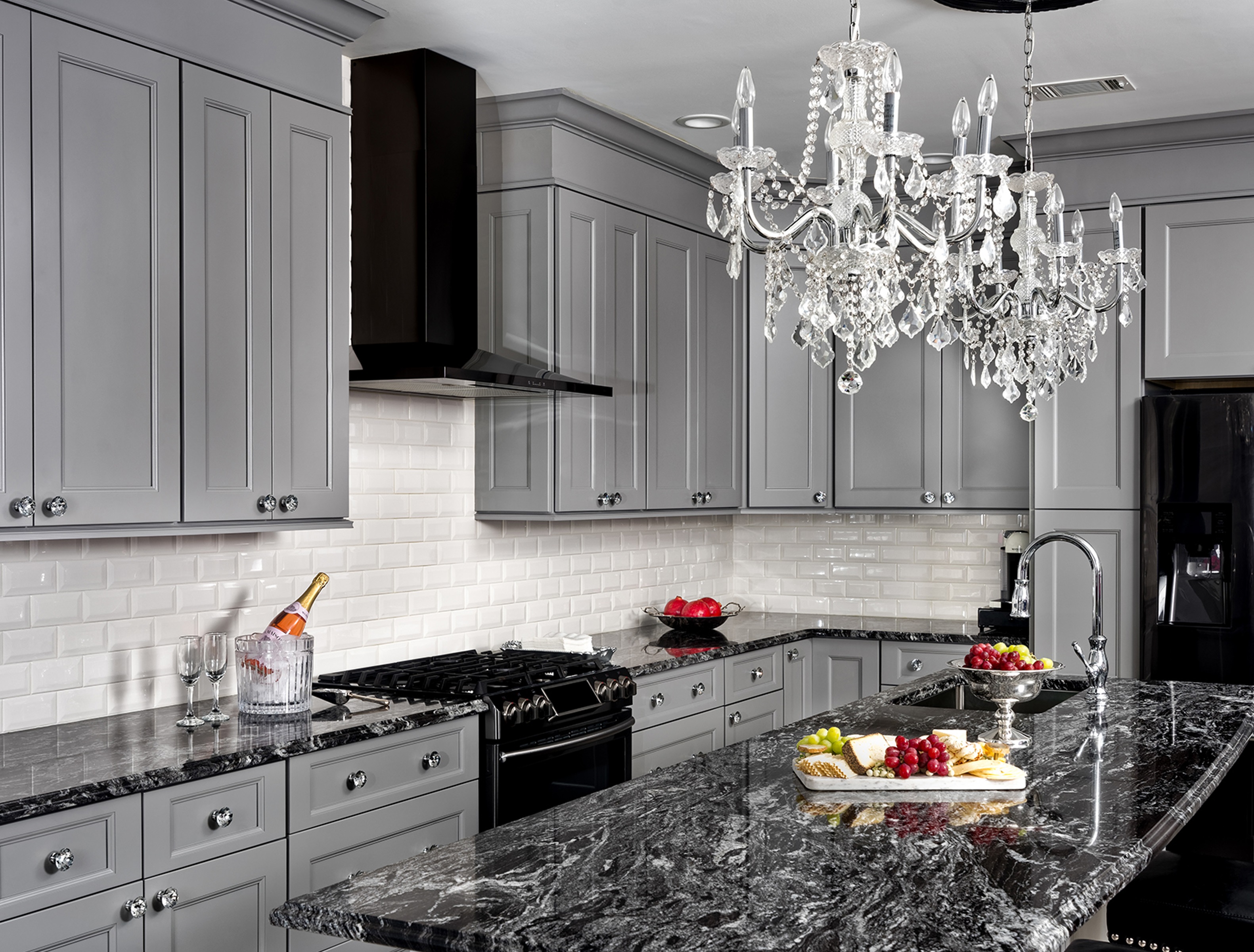 Kitchen with gray cabinets and dark countertops